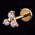 Astra — A trinity of light around one gold bead