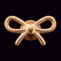 Aurelia — A ribbon tied in gold