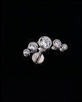 Lyra — Five bezel-set stones in a rising arc