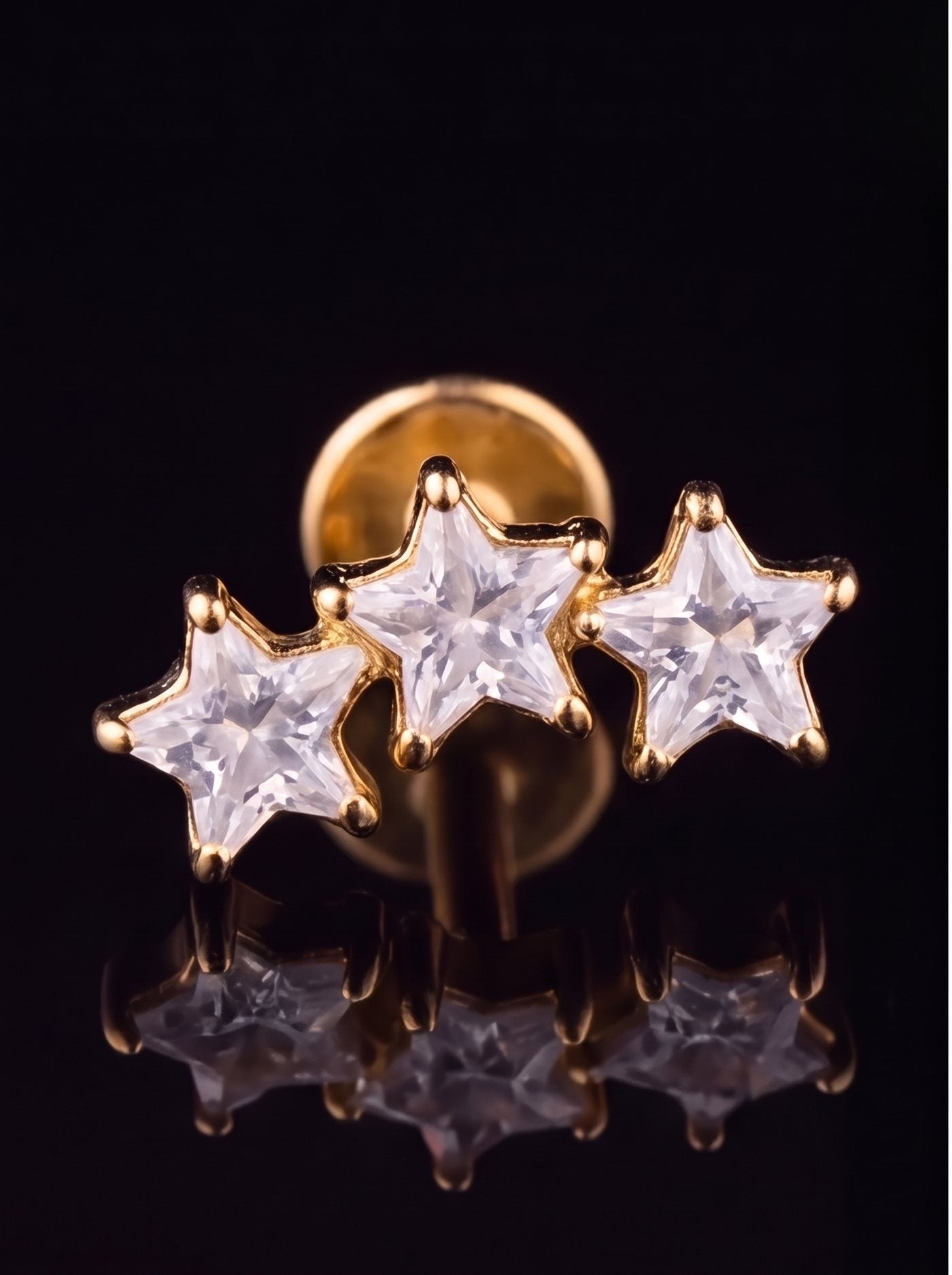 Stella — Three star-cut crystals ascending