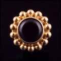 Anemone — black agate in gold PVD titanium, front